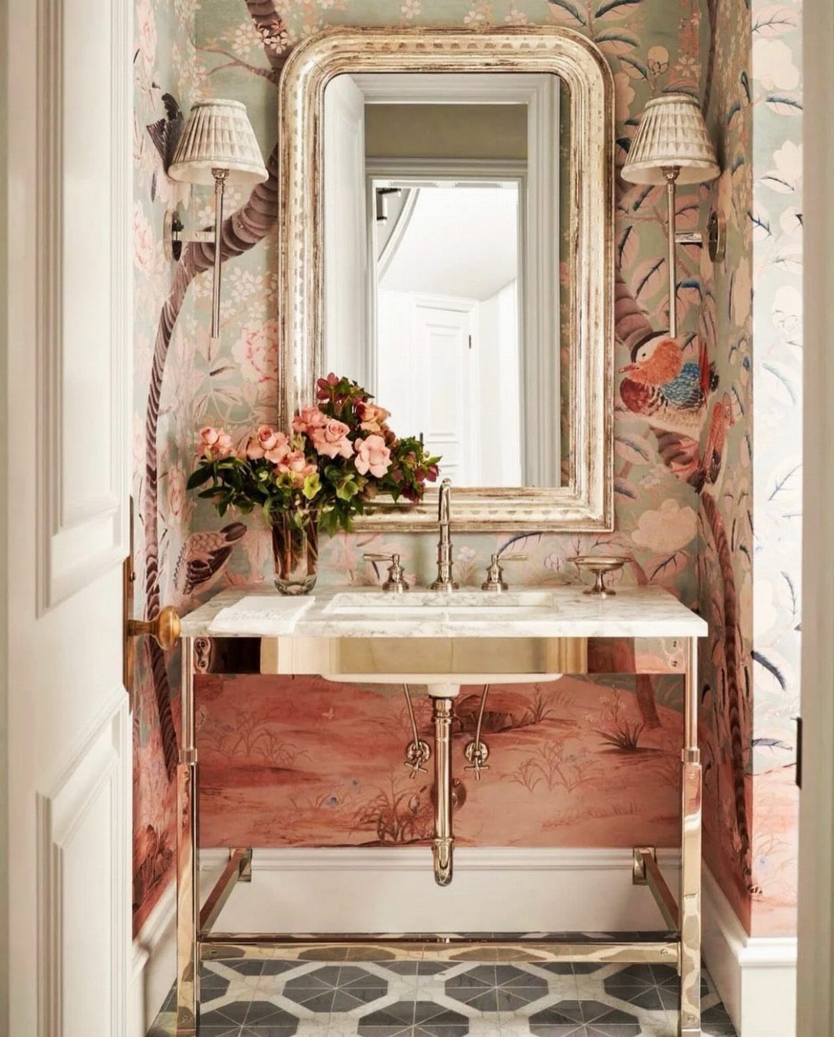 9 Bathroom Mural Ideas for Every Style and Space 8 Floral and bird mural in a bathroom with a marble vanity and gold mirror.