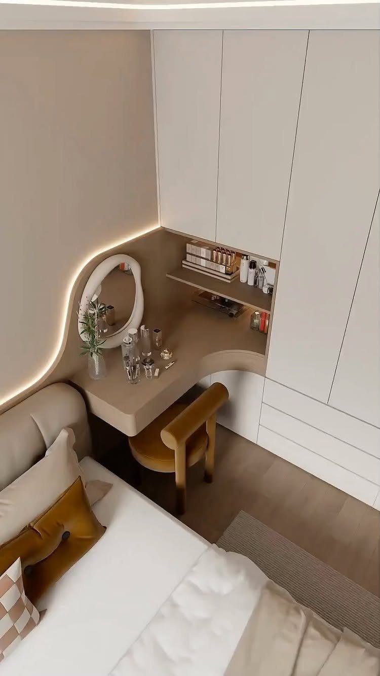 Built-in wardrobe vanity with a circular backlit mirror and curved wooden stool.